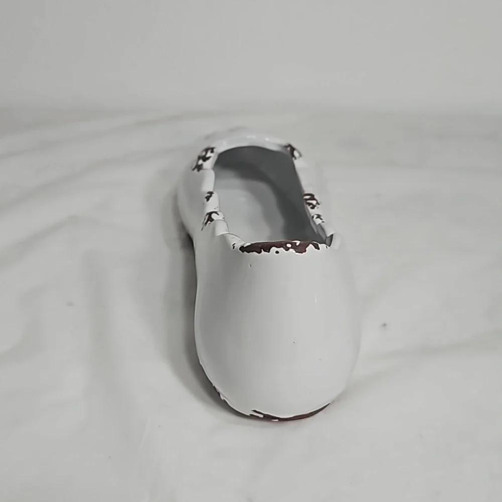 Decorative ceramic ballet shoe vase with vine design